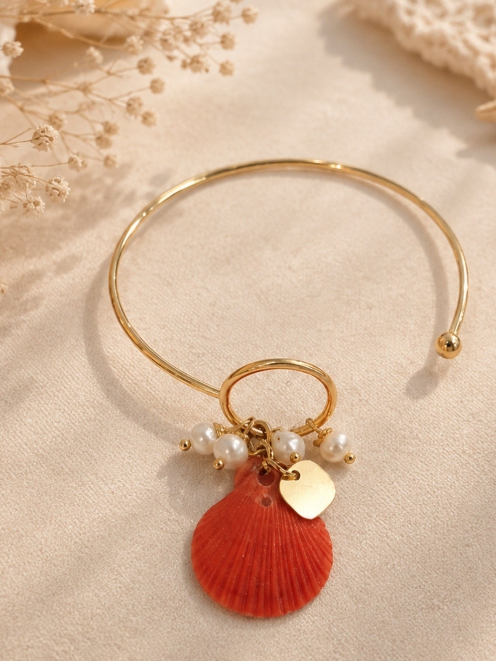 Gold-Tone Bracelet with Coral Shell Charm and Pearl Accents